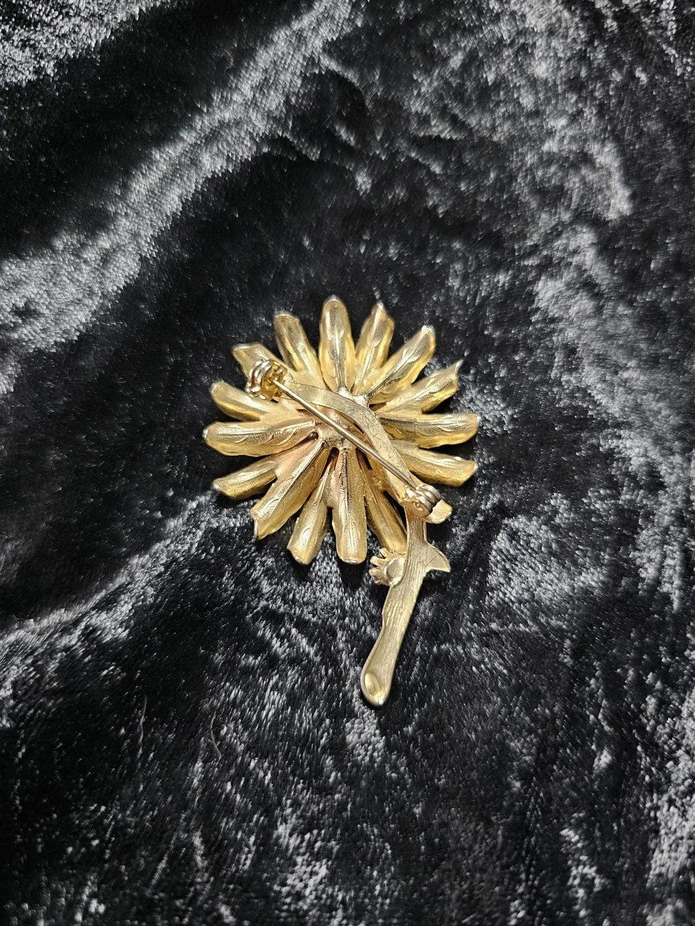 Gold Floral Brooch with Purple Gem Accent